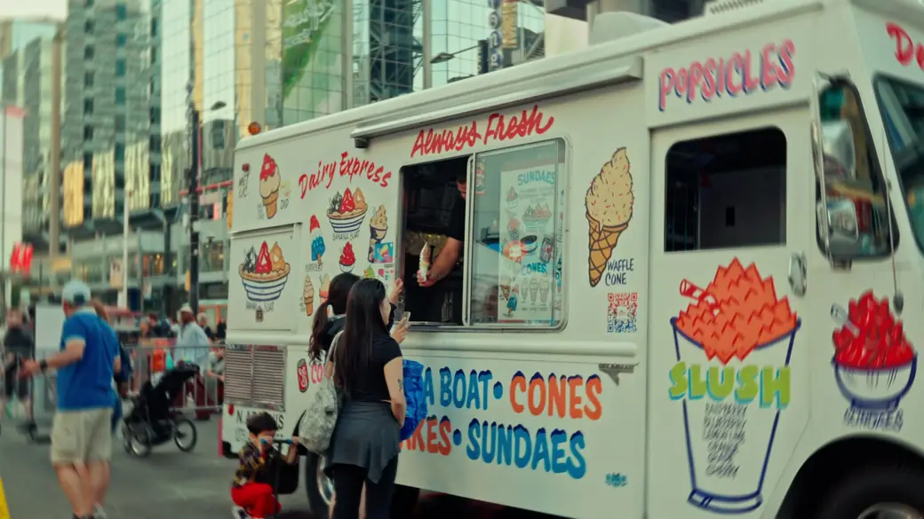 Visitors order from a hand-painted ice cream truck