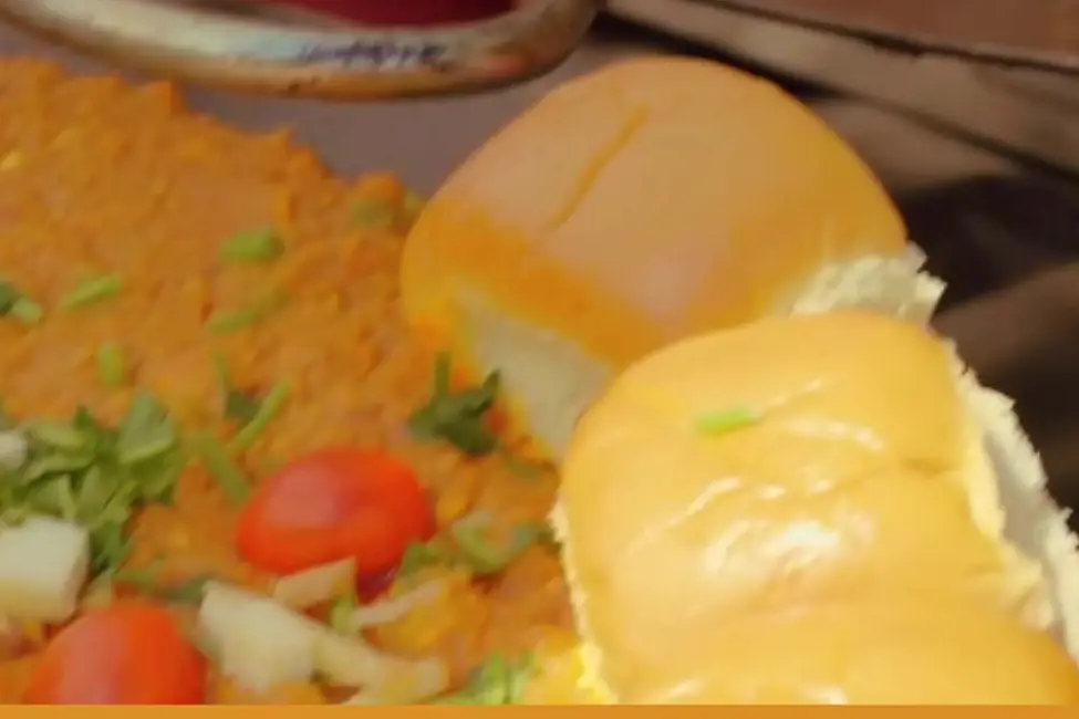 Pav bhaji with buttered buns on the griddle