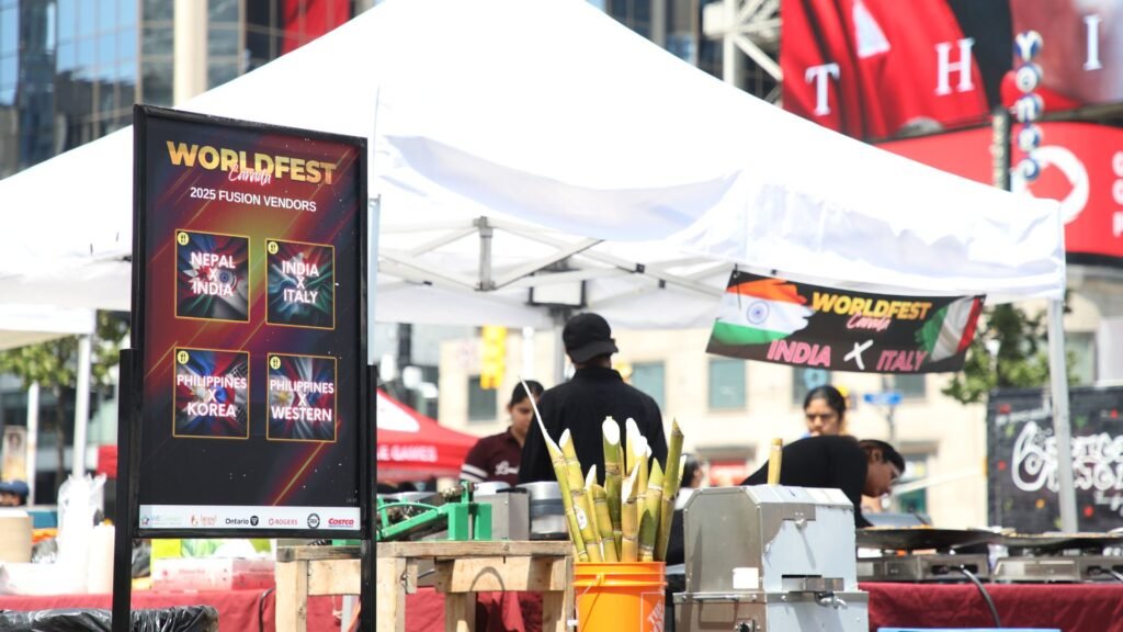 fusion Food vendors and live performances sharing space at a Toronto summer festival.