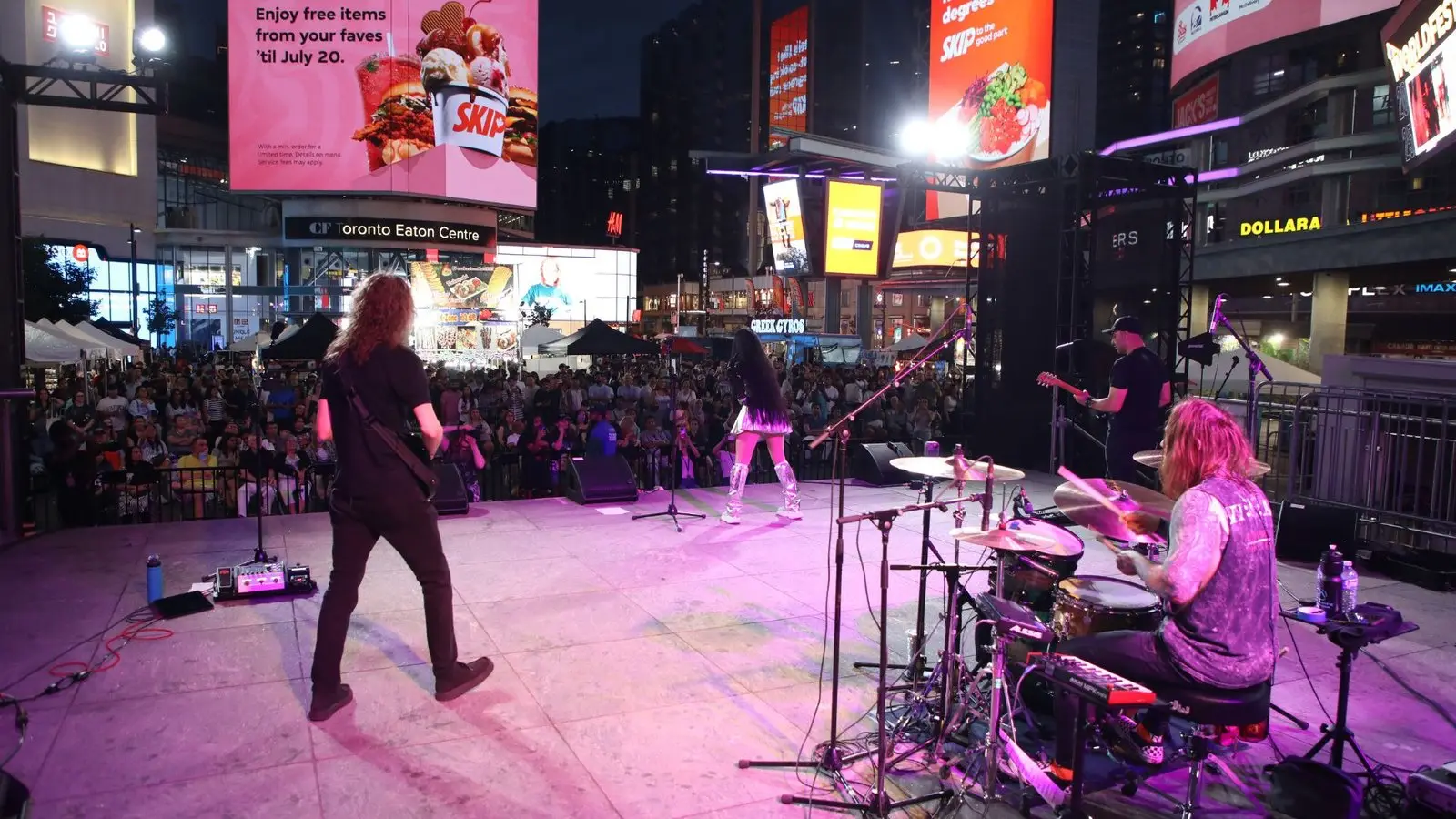 C-Magic 5 on the WorldFest main stage at night, playing to a packed Sankofa Square